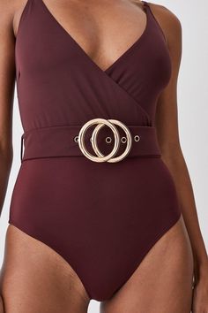 This Form-Skimming Swimsuit Makes An Elegant Choice For Warm Weather Getaways. Featuring A Plunging V-Neckline And A Gold-Tone Double Belt Design, This One Piece Promises To Exude Glamour From Pool To Beach. Style This Piece With Wide-Leg Trousers For An Understated Beach-To-Bar Look.Style: Swimsuitdesign: Plainfabric: Swimneckline: Strappy