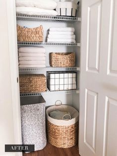 an organized closet with baskets and towels