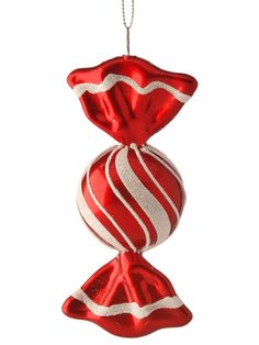 a red and white ornament hanging from a chain on a white background,