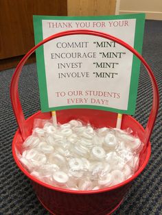 a red bucket filled with lots of white letters