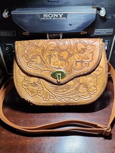 "Little bit of a project here.  It is a leather embossed floral from the 70's that is is in pretty good condition, minus the whole lacing issue. The downside to this bag, is the lacing is coming undone in multiple places.  One section was \"repaired\" and it's awful.  But if your handy with this sort thing, or use it as a opportunity to upcycle this piece into something completely different. Measures: 11 inch wide length wise 8 inches high 3 inches wide Top flap/cover is 7 inches" Inside My Bag, Western Purses, Leather Floral, Pretty Bags, Cool Fits, Southern Belle, Country Outfits, Fixer Upper, Leather Tooling