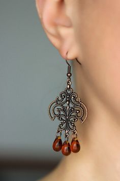 These beautiful boho earrings was made of tea color czech glass drop beads, copper chandelier charms, copper jumping rings and copper earrings hooks. Earrings hooks are from nickel free and lead free metal. Perfec for your unique outfit and a great gift for someone special! *The total lenght of earrings is about 63 mm including earring hooks. Other earrings of my shop you can see here: https://www.etsy.com/shop/NaTavelli?section_id=13757927 Thanks for visit. Brown Czech Glass Beaded Drop Earrings, Brown Czech Glass Teardrop Earrings, Bohemian Brown Teardrop Earrings For Pierced Ears, Bohemian Copper Chandelier Earrings For Gifts, Brown Czech Glass Earrings With Dangling Beads, Bohemian Brown Teardrop Earrings, Bohemian Brown Drop Chandelier Earrings, Brown Dangle Chandelier Earrings With Beads, Vintage Brown Earrings With Dangling Beads