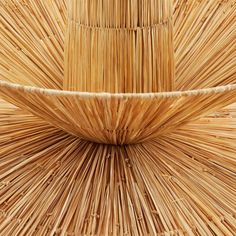 a close up view of the top of a bamboo chair made out of reeds