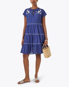 This intricately embroidered dress from Ro's Garden is sure to be a go-to in your warm weather rotation. Cut from a comfortable cotton, it features a relaxed trapeze silhouette with a tiered skirt. Wear yours with sandals and a basket bag for an effortlessly chic weekend ensemble. Cotton Tiered Beach Dress, Summer Tiered Dresses With Floral Embroidery, Cotton Tiered Dress For Vacation, Cotton Tiered Dress For The Beach, Summer Cotton Tiered Dress For Vacation, Summer Floral Embroidered Tiered Skirt Dress, Beach Cotton Tiered Dress, Summer Tiered Cotton Dress For Vacation, Cotton Tiered Vacation Dress