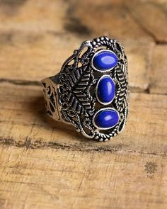 Filigree worked brass ring with lapis lazuli.  The setting of the stone is open to the finger.   Material: brass - nickel & cadmium free. Gemstone: Lapis lazuli Produced under fair conditions in India Please note that colors and contrasts may look different depending on the monitor on which the photos are viewed.     How do I determine my ring size?  The easiest way is to place a ring that fits you on a ruler and determine the inner diameter. Multiply this value by 3.14. The result is the ring c Brass Ring, Multi Stone Ring, Multi Stone, Stone Ring, Lapis Lazuli, Stone Rings, Jewelry Rings, Ring Size, Accessory Gift