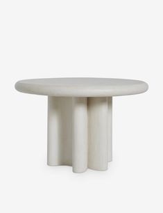 a white table with three columns on it's side and one column in the middle