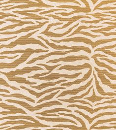 an animal print rug with brown and white stripes