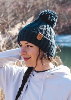 For those that Wander... Our classic super-soft cable knit hat is great for everyday wanders; forest walks with the dog, romantic evening beach strolls, or just down the pub for a cheeky pint! Lined with a fleecy faux Shearling thermal band for extra snugness it will keep you toasty warm in any weather. Finished with an UltraLeather vegan friendly tag. Our vegan 'leather' tags are hand sewn in our studio using all natural yarn. With our 'Land + Sea' logo on one side and Junkbox Apparel wordmark Forest Walks, Sea Logo, Leather Tags, Wooly Hats, Womens Hats, Mens Hats, Cable Knit Hat, Bobble Hat, The Pub