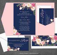 an elegant wedding suite with pink and blue flowers on the front, white envelopes and navy