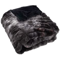 a black and grey fur blanket on a white background