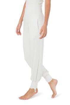 "White leggings, yoga boho pants, harem pants, loose fit wide trousers, comfy pants for travel, pants with pockets, balloon pants for women. Unique adjustable waist harem pants leggings, made of lycra and cotton, super comfortable and breathing natural fabric, stretchy and has 2 pockets. Fits for your daily sports activities, dancing, yoga, pilates, mindfulness etc. and for boho festivals and events. You'll never want to get out of it cause it's so comfy. This is a part of my new collection, whi Yoga Joggers With Elastic Waistband, Harem Yoga Pants With Elastic Waistband For Loungewear, Long Yoga Pants With Elastic Waistband For Relaxation, Yoga Pants With Elastic Waistband For Relaxation, Relaxed Fit Yoga Pants For Meditation, White Relaxed Fit Harem Pants For Yoga, Stretch Wide Leg Harem Pants For Relaxation, Stretch Wide-leg Harem Pants For Relaxation, Loosely Fitted Harem Pants With Elastic Waistband For Relaxation