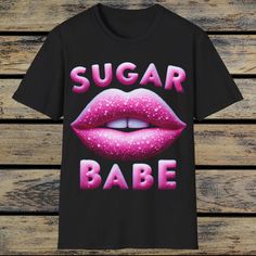 Sugar Babe T-Shirt,Pink Lips T-Shirt,Pink Lipstick Shirt,Girly Fashion,Lip Graphic Shirt,Trendy Pink Shirt,Lip Print Top,Cute Style Tee. The unisex soft-style t-shirt puts a new spin on casual comfort. Made from very soft materials, this tee is 100% cotton for solid colors. Heather colors and sports grey include polyester. The shoulders have twill tape for improved durability. There are no side seams. The collar is made with ribbed knitting to prevent curling damage.  .: Made with 100% ring-spun Pink Slogan T-shirt With Short Sleeves, Trendy Pink T-shirt With Text Print, Funny Pink T-shirt With Text Print, Cute Pink T-shirt With Graphic Print, Trendy Pink T-shirt With Screen Print, Cute Pink T-shirt With Text Print, Pink Slogan T-shirt For Streetwear, Pink Slogan T-shirt With Crew Neck, Pink Slogan Crew Neck T-shirt