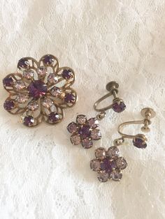 Vintage /Antique Brooch/Earrings Set, screw back old fashion style earrings, purple stones, very Pretty and danity Style, Gold/Brass like settings. No box included. Measurements Approximately: Let me know if questions All sales are final Buy vintage and save our environment. Purple Brooch, Old Earrings, Pink Jewels, Earrings Purple, Antique Brooches, Purple Stones, Purple Crystals, Gold Brass, Screw Back Earrings