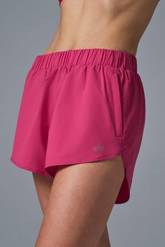 Sporty and sweet at the same time, these shorts are exactly what your closet is craving. Made from a slightly swishy, slightly stretchy fabric, they have ripstop panels down the sides and a sheer panel in back for extra style points. Peep the versatile elastic waist (sling it low or high) and the zippered side pockets (prime for holding a hair tie or credit card). And one last thing—there’s a coordinating Playmaker Jacket, should you want to finish the fit. Womens Onesie, Dolphin Shorts, Tank Top Bras, Womens Capris, Tank Top Long Sleeve, Pink Summer, Alo Yoga, Hair Tie, Bra Women