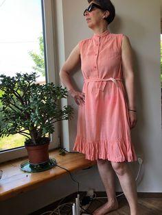 Vintage 90s summer dress. Sleeveless peach pink sun dress with stand up collar. Waist up buttoned dress with side pockets. Gauze cotton dress. M size. From shoulder to shoulder  14,5" 37cm Bust  37"  94cm Waist  40"  102cm Length  40" 102cm. 100% cotton. Sleeveless Peach Cotton Dress, Pink Sleeveless Summer Dress For Daywear, Peach Sleeveless Cotton Dress, Pink Cotton Sleeveless Summer Dress, Pink Sundress Sleeveless For Daywear, Pink Sleeveless Sundress For Daywear, Casual Peach Sleeveless Sundress, Vintage Sleeveless Sundress For Daywear, 90s Summer Dress