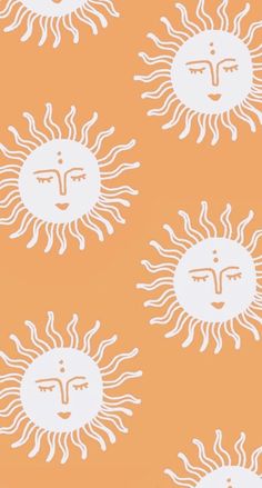 an orange and white wallpaper with sun faces