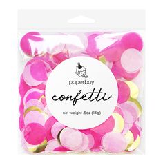 a bag of pink and yellow confetti in it's packaging on a white background