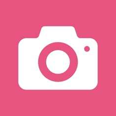 a pink and white camera on a pink background