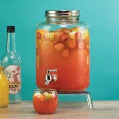 a beverage dispenser filled with liquid and fruit