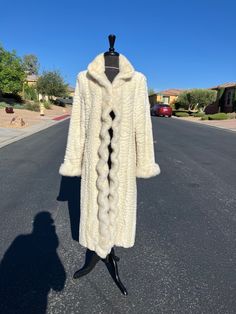 LT (12T) FAKE fur FAUX fur, vegan fur ivory imitation Persian Lamb and mink full length coat, by Donna Sayler's Fabulous Furs, EUC (#2511) EUC = excellent used condition A very soft, ivory, full-length imitation Persian Lamb (Karakul) and imitation mink FAKE FUR ... FAUX FUR ... VEGAN FUR jacket coat.  The swirl texture of this "fur" has been shaped to mimmick the look and feel of Persian Lamb or Karakul fur.  Surprisingly light-weight.  I don't normally sell fake fur items, but this is a very nice quality FAKE FUR.  Imitation mink fur forms a tuxedo collar and front trim, as well as decoration at the cuffs.  The tuxedo style front trim has a wavy/curled layout which is quite pretty.  A classic high collar and nicely crafted "pelts" really add class to this faux fur full-length coat.  The Winter White Long Fur Coat With Faux Fur Trim, Cream Fur Coat With Faux Fur Lining, Cream Faux Fur Coat With Faux Fur Lining, White Long Coat With Faux Fur Lining, Winter White Fitted Faux Fur Coat, Fitted Winter White Faux Fur Coat, White Fitted Long Fur Coat, Cream Long Fur Coat With Faux Fur Lining, Cream Fitted Fur Coat With Faux Fur Trim