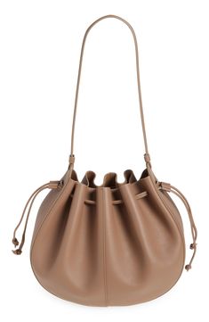 A softly structured silhouette inspired by blooming flowers defines this Italian-made bag done in supple tumbled leather and topped with a pair of drawstrings. Drawstring closure Shoulder strap Leather Made in Italy Designer Handbags Spring Elegant Leather Bucket Bag, Elegant Leather Bucket Bag For Spring, Spring Textured Leather Bags, Spring Leather Bucket Bag With Removable Pouch, Elegant Textured Leather Bags For Spring, Spring Season Soft Leather Bags, Mansur Gavriel Bucket Bag, Mansur Gavriel, Leather Bucket Bag