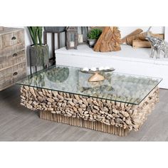 a coffee table made out of rocks and glass