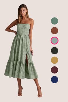 a woman wearing a green dress with different colors