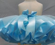 This tutu is great for birthday outfit or any event. Made with tulle, ribbons and elastic. Light blue tutu skirt. Ribbon satin bow attached. Light blue tutu skirt. Baby tutu skirt. Toddler tutu. Girl tutu. Princess tutu. First birthday outfit. First birthday tutu. Birthday outfit. My tutus are all made by sewing and ironing. It has a perfect finish. My tutus are all made by sewing and ironing. It has a perfect finish. Rainbow Tutu Skirt. Baby girl tutu dress. Toddler girl tutu skirt. Toddler dre Blue Ruffled Princess Dress For First Birthday, Blue Princess Tutu Dress With Bow, Princess Style Blue Tutu Dress With Bow, Organza Tutu Dress With Ruffles For First Birthday, Blue Princess Dress With Ruffles For Party, Light Blue Ruffled Princess Dress For Party, Blue Tulle Dress For First Birthday, Blue Ruffled Tutu Dress For Party, Blue Princess Dress For First Birthday