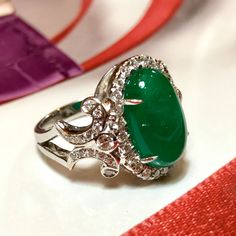 MADE TO ORDER ONLY! 1 week gold crafting period. EXTREMELY VIVID, Certified 7.57 carats, COLOMBIAN Emerald ring. SUGGESTED RETAIL VALUE: $18,000 EMERALD: Weight: 6.63 carats Shape: Oval Cabochon Dimensions: 9.27 x 14.73 x 5.90 mm Color: Green Origin: COLOMBIAN NATURAL EMERALD WITH OIL TREATED ONLY (F3) Gemological certificate provided as shown. TRANSPARENT EXTREMELY CLEAN EXCELLENT COLOR AND CUT! RARE VIVID, COLOMBIAN, BLUISH-GREEN COLOR!! DIAMONDS: 50 round brilliant diamonds weighting a total Platinum Oval Emerald Ring With 17 Jewels, Oval Platinum Emerald Ring With 17 Jewels, Luxury Cabochon Diamond Ring For Formal Occasions, Luxury Formal Cabochon Diamond Ring, Luxury Diamond Cabochons For Wedding, Luxury Diamond Ring With Oval Cabochon Gemstone, Luxury Oval Cabochon Diamond Ring With Gemstone, Formal Hallmarked Diamond Cabochons, Luxury Oval Cabochon Diamond Gemstones