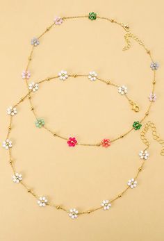 A vibrant charm necklace to brighten up your look! An arrangement of colorful beads intricately woven together to create a charming floral centerpiece.  DIMENSIONS Length: 15" Ext: 3' ball ext. Clasp: lobster claw Metal Finish: Gold Plated Product: Lead & Nickel Compliant Anti-tarnish: Double E-Coating Multicolor Flower Necklace For Spring Gift, Multicolor Flower Necklace As Spring Gift, Spring Multicolor Flower Necklace As Gift, Multicolor Beaded Jewelry For Mother's Day, Dainty Multicolor Flower Necklace, Adjustable Multicolor Flower Necklace For Spring, Dainty Multicolor Flower Jewelry, Spring Multicolor Adjustable Flower Necklace, Adjustable Multicolor Necklace With Flower Charm