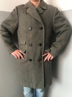 Absolutely rare find! 1960s or late 1950s Aquascutum mens' authentic winter double breasted coat Scottish Tweed Herringbone Fur fully lined  Three pockets at front with rounded flaps + 1 inner pocket raglan sleeve Made by Aquascutum in England Quite heavyweight - almost 2 kilos Size L (on photo my son - he is in between M and L - so this coat is roomy for him) Measurements taken in flat position  Height 40"/102 cm pit to pit 23"/54,5 cm 1 shoulder 6,5"/15,5 cm + sleeve 26"/66 cm Condition  Good! Coat keeps its shape, fabric is still stiff  It has been dry cleaned and I kept on the air and under the sun (covered,of course) Flaws - lease check my video https://youtube.com/shorts/Of0_A3OlEuM?feature=share I have found  in 3 places 1. In the left shoulder area 2 tiny - but they are not deep an Vintage Fitted Long Pea Coat, Vintage Single-breasted Long Pea Coat, Retro Formal Tweed Jacket For Winter, Retro Winter Outerwear With Notch Lapel, Retro Notch Lapel Outerwear For Winter, Vintage Double-breasted Winter Outerwear, Vintage Double-breasted Pea Coat With Double Button Closure, Vintage Single-breasted Wool Coat For Winter, Vintage Single-breasted Winter Pea Coat