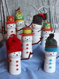 snowmen made out of plastic cups and hats