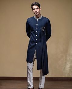 "Give yourself a best ethnic look by wearing this Hand kadhaai Indian Sherwani with pants. Made of Rich blend fabric this regular-fit set comprises a full-sleeved Indian Sherwani kurta with Pajama. This outfit with mojris will look apart on special occasions like in Wedding, Parties, Engagement, Family Functuons, etc. Metarial : Cotton fabric, Handmade Buttons. Color : Dark Blue (More Color Options are Available) Sleeves : Long Pockets : Available (In Pants) Sherwani kurta with pant Set White Co Bollywood Style Sherwani With Dabka In Traditional Fit, Bollywood Style Sherwani With Long Sleeves, Designer Naqshi Sherwani For Navratri, Navratri Designer Sherwani With Naqshi Detailing, Navratri Designer Sherwani With Naqshi, Elegant Bandhgala With Dabka For Navratri, Designer Naqshi Kurta For Navratri, Traditional Fit Bandhgala With Dabka For Ceremonies, Navratri Kurta With Naqshi In Traditional Drape