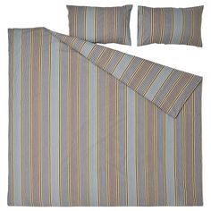 a blue and yellow striped bed spread with two pillow cases on top of each other