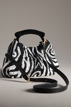 Glass beads, acrylic sequins; cotton lining Removable crossbody strap One inner slip pocket Magnetic closure Imported | Sequin Animal Clutch by Anthropologie in Black, Women's, Cotton/Acrylic/Glass 50 Fashion, Crossbody Strap, Magnetic Closure, Color Coding, Glass Beads, Anthropologie, Sequin, Bag Accessories, Beads