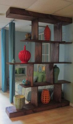 a room with blue walls and wooden shelves