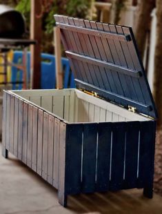 an open chest sitting on top of a sidewalk