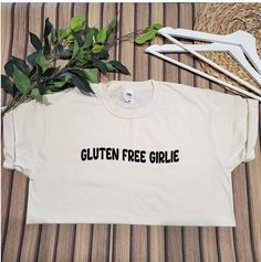 Gluten Free Girlie Tee This t-shirt will make a perfect gift for a birthday, Christmas, or any other occasion. Please note that these t-shirts are a loose fit. Any questions just ask! If you like my products please favourite my shop, so you can stay up to date on my latest products and projects.  You can also find us on these... https://www.instagram.com/simithecoeliac/ Gluten Free Gifts, Coeliac Disease, Peanuts T Shirts, Personalized Aprons, Fabric Banner, Free Tshirt, Funny Mothers Day, Mothers Day Presents, Ladies T Shirt