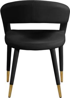 a black chair with gold legs on a white background