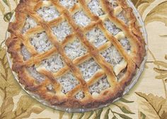 a pie sitting on top of a table covered in rice