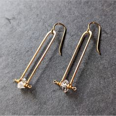 These Beautiful Frame Earrings Have A Modern Bohemian Feel And Feature A Natural Nugget Shaped Herkimer Diamond Crystal On Graceful, 14k Gold-Filled Rectangular Frames. Each Gemstone Is Unique. Hand Hammered And Shaped In Enclave Gems & Co.'S California Studio. Fish Hook Backs. Nwt. Measurements Drop: 2" Bottom Bar: 0.63" Wire Jig Earrings, Gem Studio, Hammered Wire Jewelry, Frame Earrings, Rabbit Earrings, Bone Earrings, Earring Ideas, Artisan Earrings, Loop Earrings