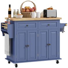 a blue kitchen island with baskets on it