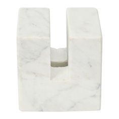 a white marble letter shaped like a block