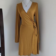 Brand New, Never Word With Tags. Super Cute Deep Plunge Faux Wrap Dress. The Color Is A Deep Mustard Yellow, A Great Addition For Your Fall Wardrobe. Fitted Faux Wrap Dresses For Fall, Fall Mini Dress With Tie Waist And Surplice Neckline, Spring Fitted Mini Dress With Faux Wrap, Spring Fitted Faux Wrap Mini Dress, Spring Faux Wrap Fitted Mini Dress, Faux Wrap V-neck Dress For Fall, Fitted Wrap Dress For Brunch, Fitted Wrap Dress For Fall Date Night, Fitted Wrap Dress For Day Out