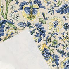 two sheets of paper with blue and yellow floral designs on them next to each other