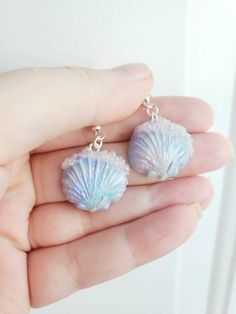 How pretty are these seashell earrings!?! light weight and comfortable!! A great unique gift for yourself or others! Hand sculpted blue pearl like iridescent seashell with clear bubbles! FREE GIFT WITH EVERY ORDER! Check out my other cute designs!! https://www.etsy.com/ca/listing/1266057299/pearl-mermaid-earringssea-shell https://www.etsy.com/ca/listing/1266078141/pastel-mermaid-earringssea-shell Ocean-inspired Shell Earrings With Ear Wire, Ocean-inspired Shell Earrings For Gifts, Ocean-inspired Shell-shaped Earrings For Gifts, Ocean-inspired Shell Earrings, Ocean-inspired Shell Earrings As Gift, Ocean-inspired Drop Earrings For Gifts, Resin Dangle Earrings For Beach, Ocean-inspired Drop Earrings Gift, Ocean-inspired Drop Earrings For Gift