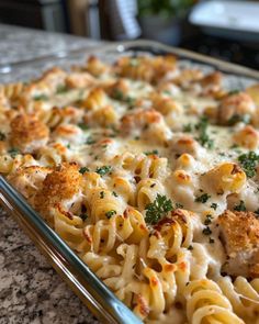 a casserole dish filled with pasta and cheese