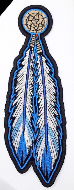 a blue and white feather design on a white background