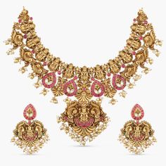 Buy Aditya Temple Antique Necklace | Tarinika Ornate Meenakari Temple Necklace For Puja, Ornate Temple Necklace With Meenakari For Puja, Ornate Meenakari Necklace For Puja, Ornate Meenakari Necklaces For Puja, Bollywood Style Peacock Design Necklaces For Rituals, Ornate Motif Jewelry For Weddings, Festive Wedding Temple Necklace With Peacock Design, Chandbali-shaped Temple Necklace With Motifs For Wedding, Ornate Kundan Necklace With Peacock Chandbali Design