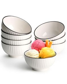 four bowls filled with different types of ice cream